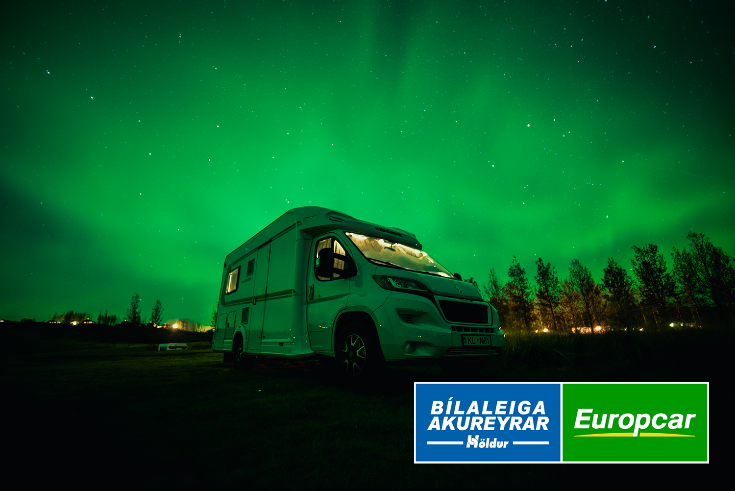 Camping car in Iceland under dream green aurora borealis sky