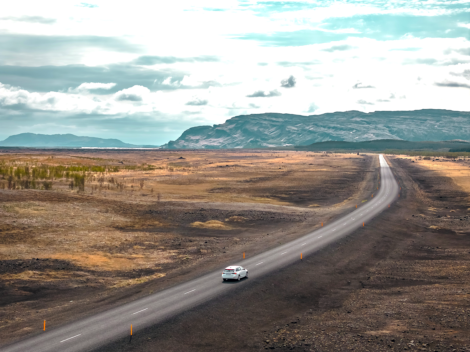 Rental car from Holdur car rental in iceland driving in fair weather on a paved road