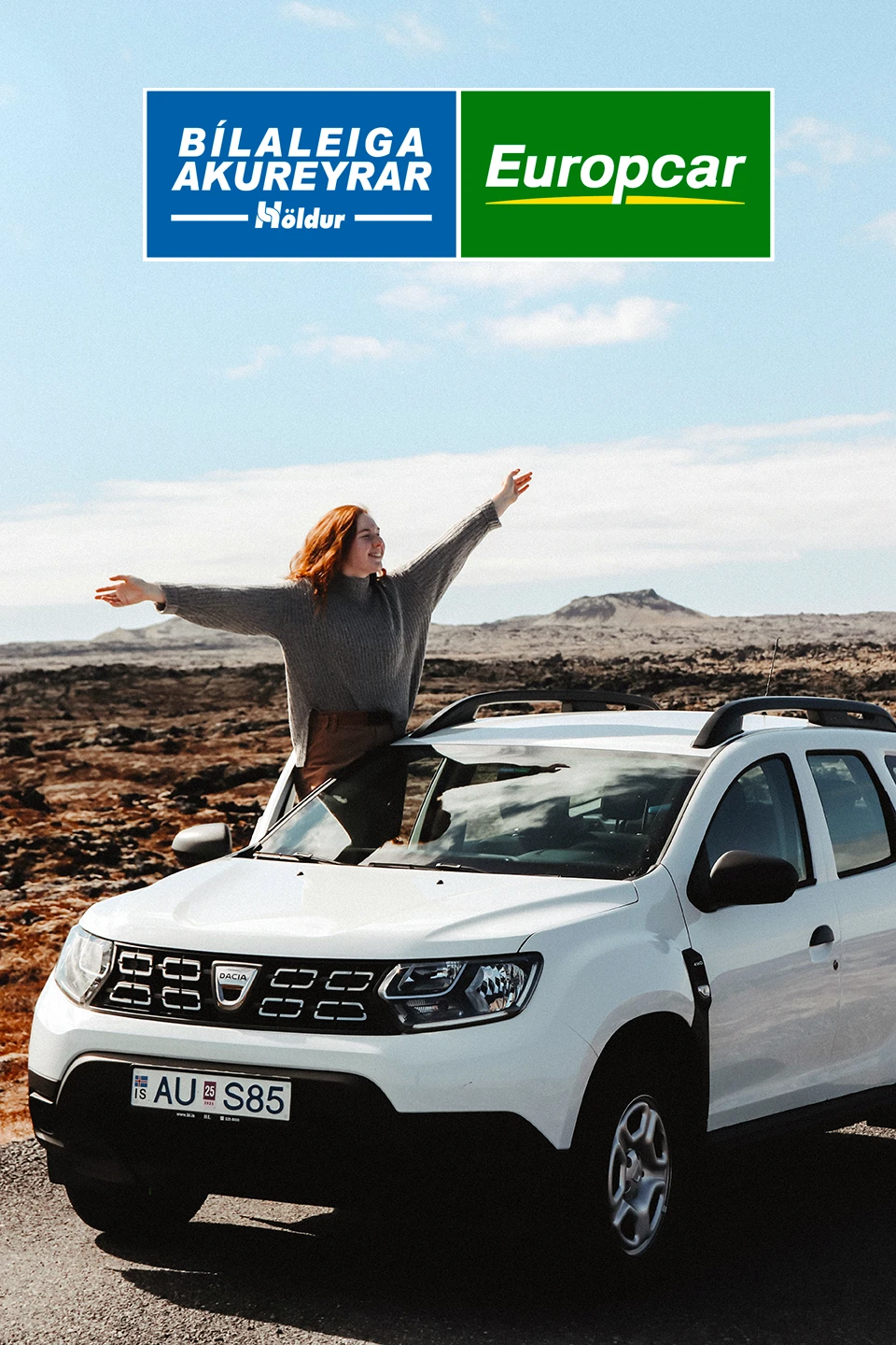 Woman standig out side of an Dacia Duster SUV rental car in Iceland