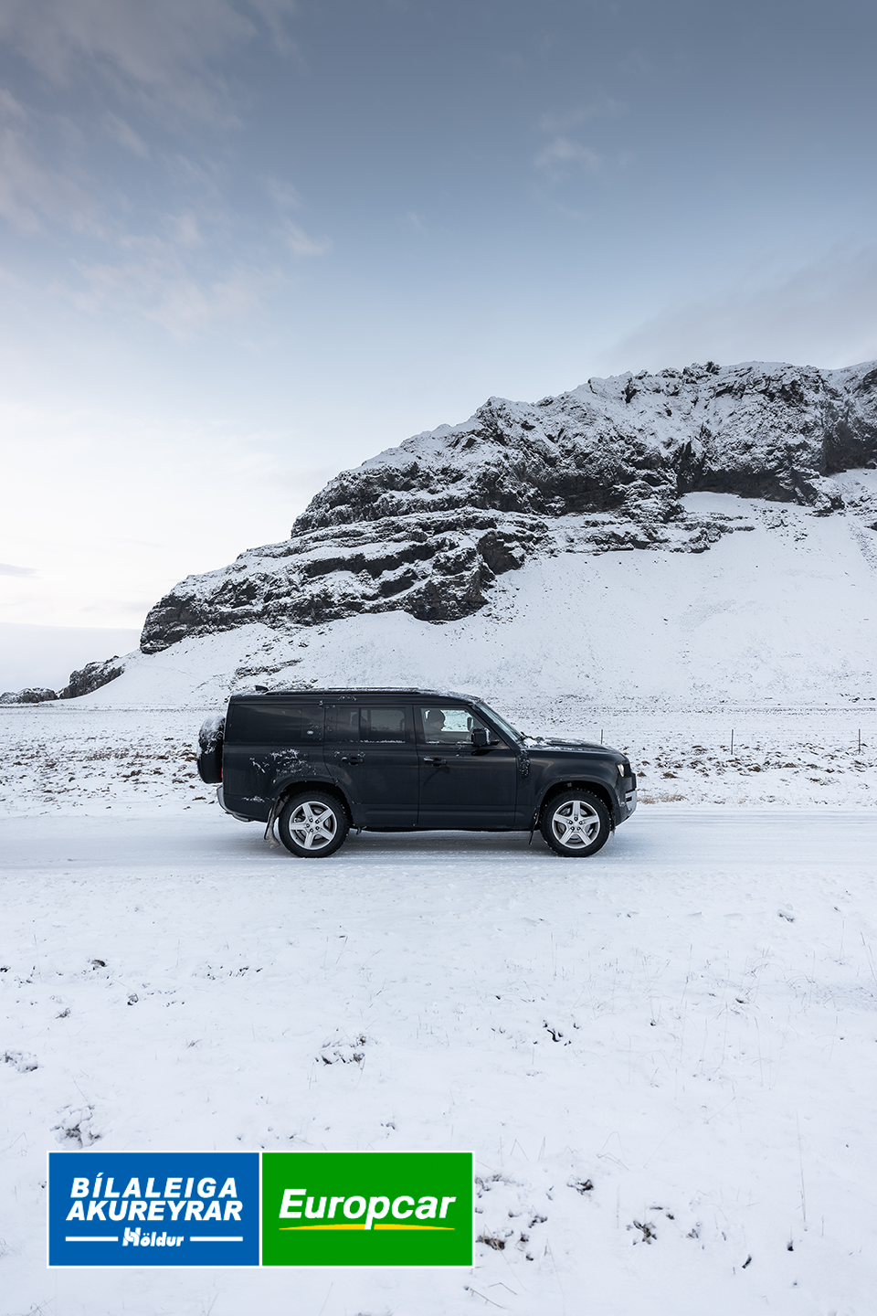 SUV from Holdur car rental driving in Icelandic arctic winter sunset in sub-zero temprature